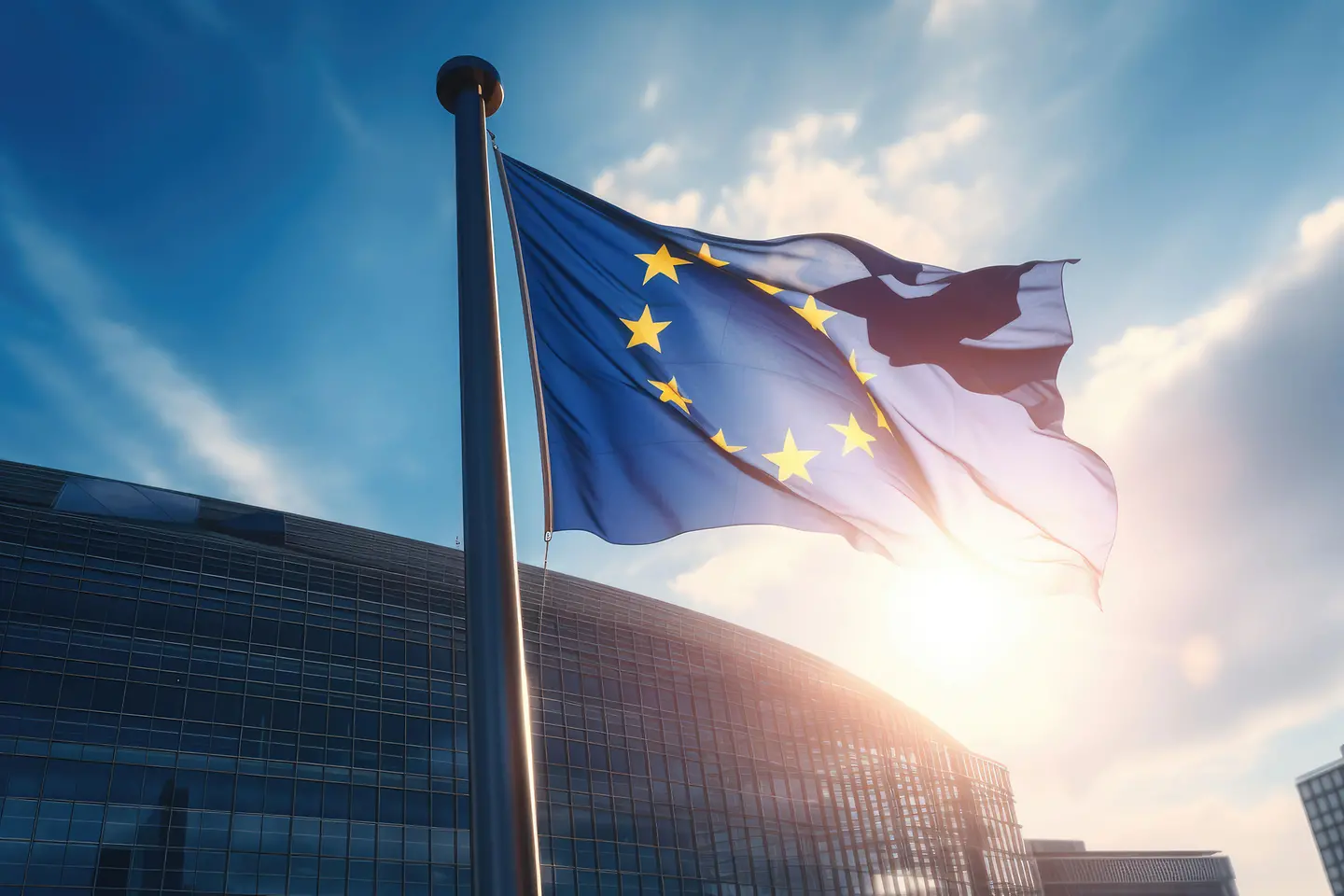 EU flag waving in front of modern building with sunshine - AI generated/adapted